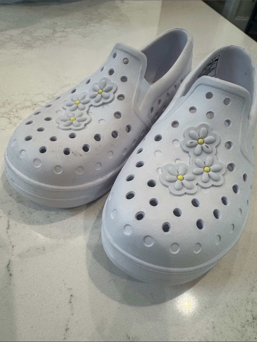 Toddler size 12 Carter’s White Slip-On Floral Shoes